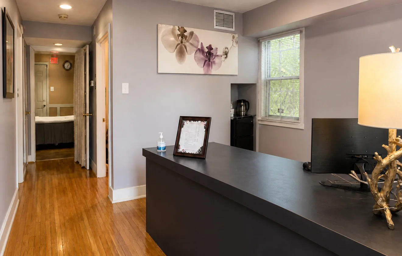 Reception desk and hallway at Wellness Foot Spa in Glenside, PA.