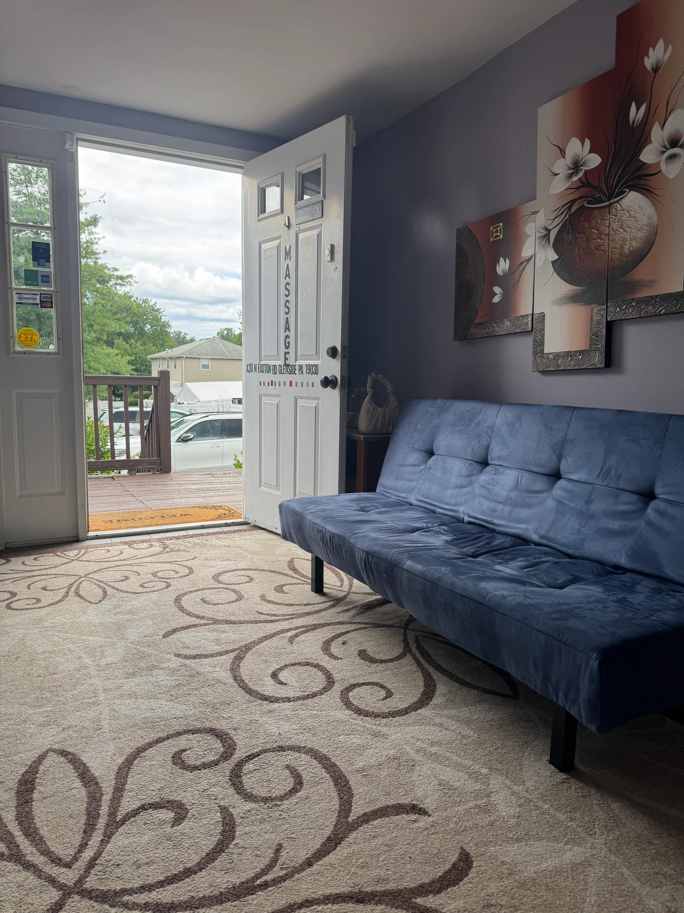 Blue sofa beside the entrance at Wellness Foot Spa, 430 N Easton Rd in Glenside, PA